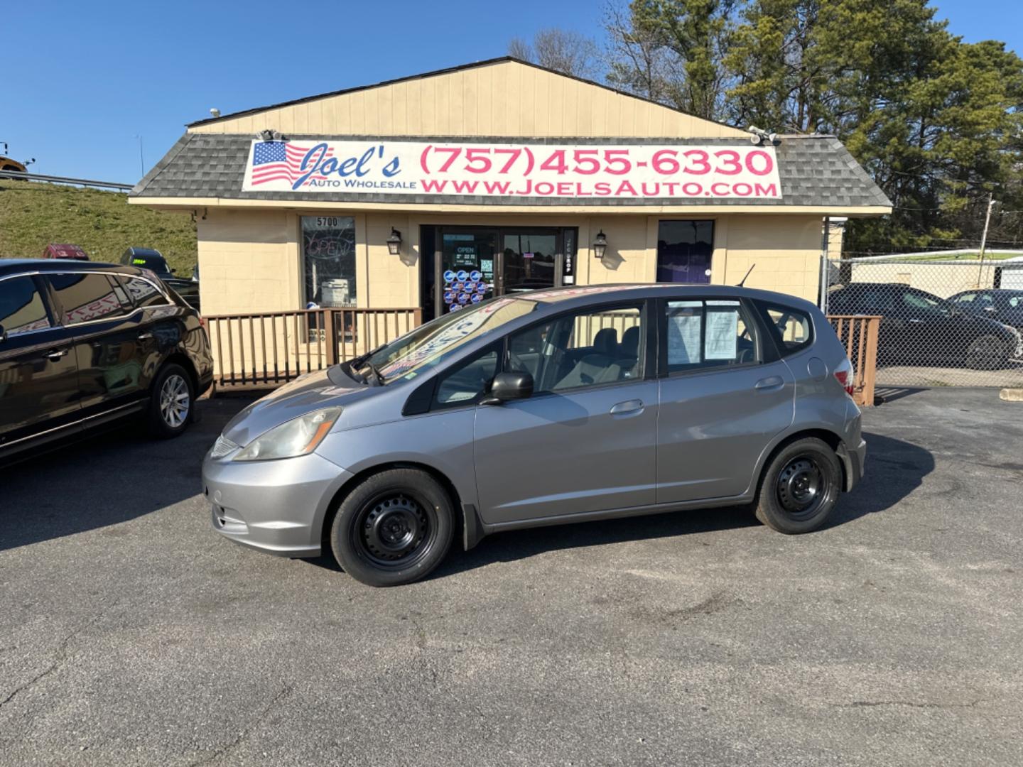 2009 Silver Honda Fit 5-Speed AT (JHMGE88299S) with an 1.5L L4 SOHC 16V engine, 5-Speed Automatic transmission, located at 5700 Curlew Drive, Norfolk, VA, 23502, (757) 455-6330, 36.841885, -76.209412 - Photo#0